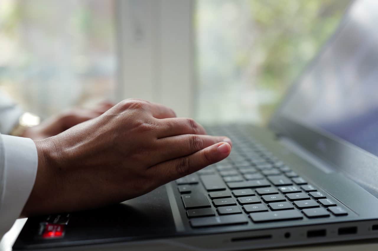 Healthcare professional operating NLS diagnostic machine