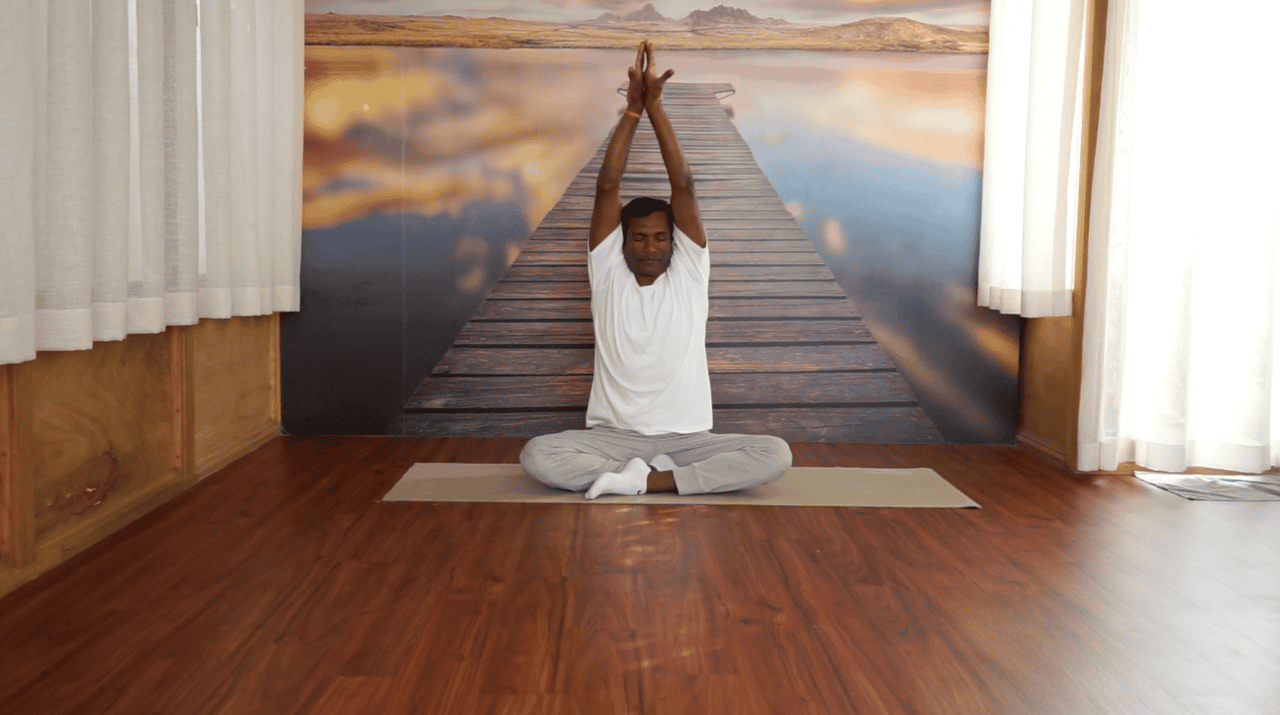 Yoga self-practice instruction for mind-body movement therapy at Healers Clinic Dubai - Patient learning independent practice techniques in tranquil setting